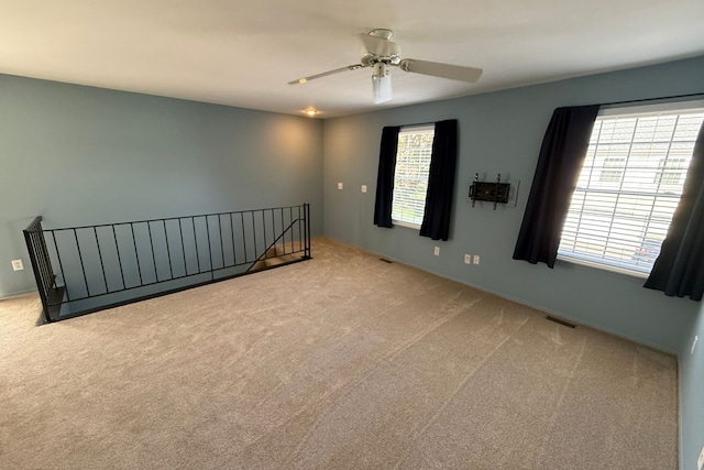 1478 Harbor Dr, Walled Lake, MI 48390 - unfurnished room with light carpet, plenty of natural light, and ceiling fan