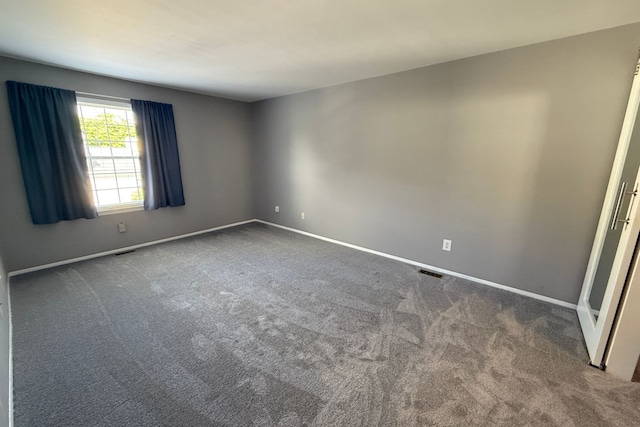 1478 Harbor Dr, Walled Lake, MI 48390 - spare room featuring carpet flooring and baseboards