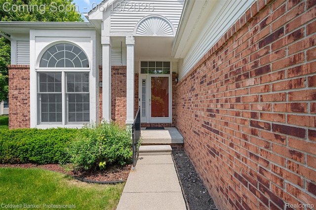634 Eastway Cir Unit # 20, Lapeer, MI 48446 - property entrance featuring brick siding