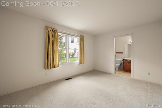 634 Eastway Cir Unit # 20, Lapeer, MI 48446 - unfurnished bedroom with light colored carpet and ensuite bath