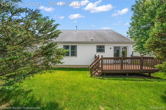 634 Eastway Cir Unit # 20, Lapeer, MI 48446 - rear view of house featuring a wooden deck, a lawn, and roof with shingles