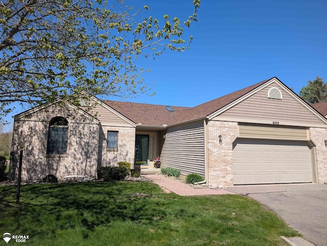 9419 Grandview Ct, Davison, MI 48423 - ranch-style house with brick siding, a garage, asphalt driveway, and a front lawn