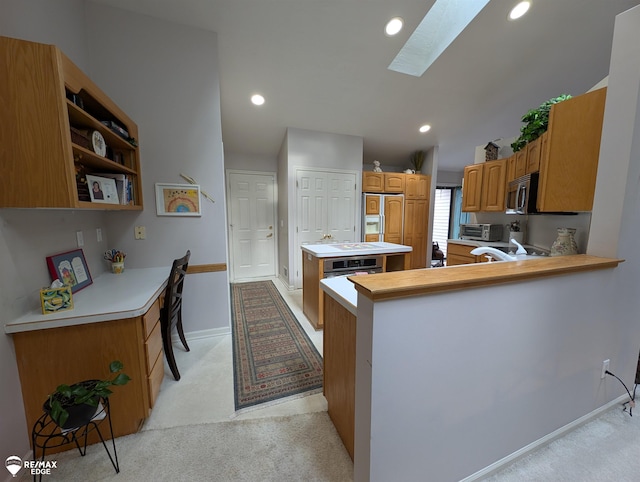 9419 Grandview Ct, Davison, MI 48423 - kitchen with a skylight, stainless steel microwave, light carpet, recessed lighting, and paneled built in fridge