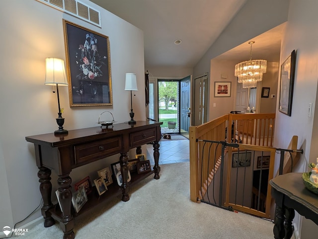 9419 Grandview Ct, Davison, MI 48423 - hallway featuring an upstairs landing, vaulted ceiling, a chandelier, carpet, and tile patterned floors