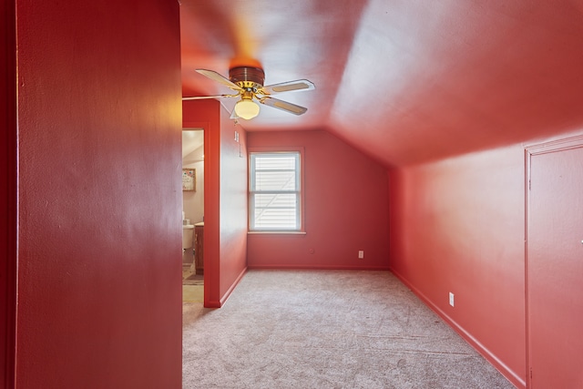 2270 23rd St, Wyandotte, MI 48192 - additional living space with light colored carpet, lofted ceiling, a ceiling fan, and baseboards