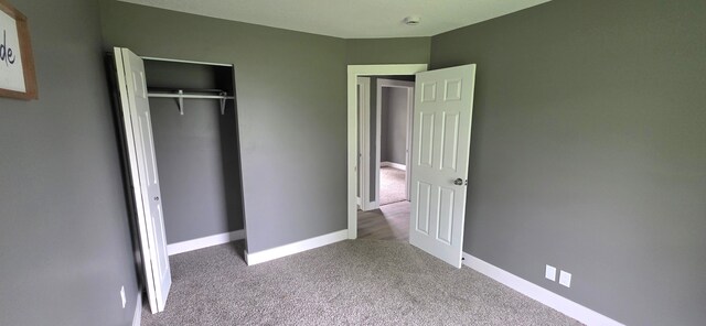 6241 Bermuda Ln, Mount Morris, MI 48458 - unfurnished bedroom featuring carpet, baseboards, and a closet