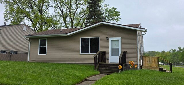6241 Bermuda Ln, Mount Morris, MI 48458 - rear view of house with a lawn