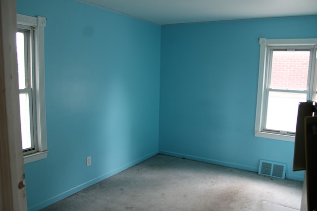 1093 Ford Blvd, Lincoln Park, MI 48146 - carpeted empty room featuring healthy amount of natural light and baseboards