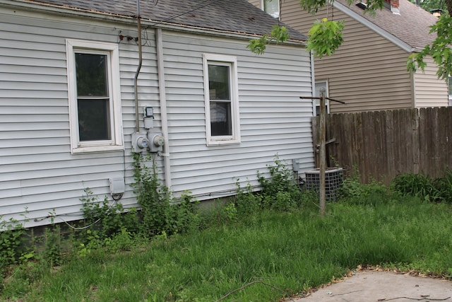 1093 Ford Blvd, Lincoln Park, MI 48146 - view of property exterior featuring central AC and a shingled roof