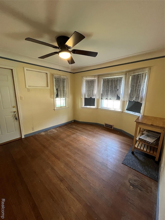 20711 Gaukler St, Saint Clair Shores, MI 48080 - unfurnished living room featuring ceiling fan, wood finished floors, plenty of natural light, and ornamental molding