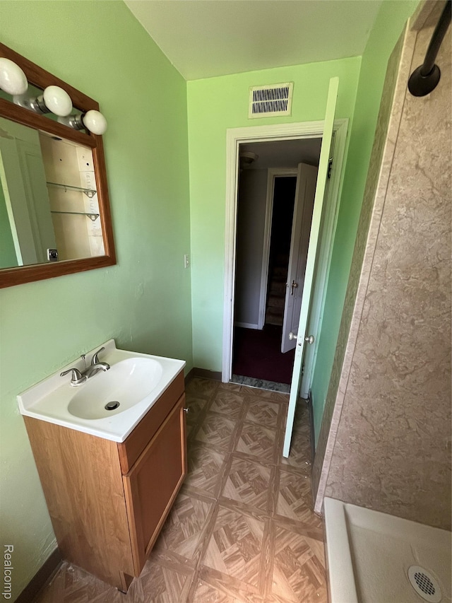 20711 Gaukler St, Saint Clair Shores, MI 48080 - bathroom featuring vanity and a shower stall