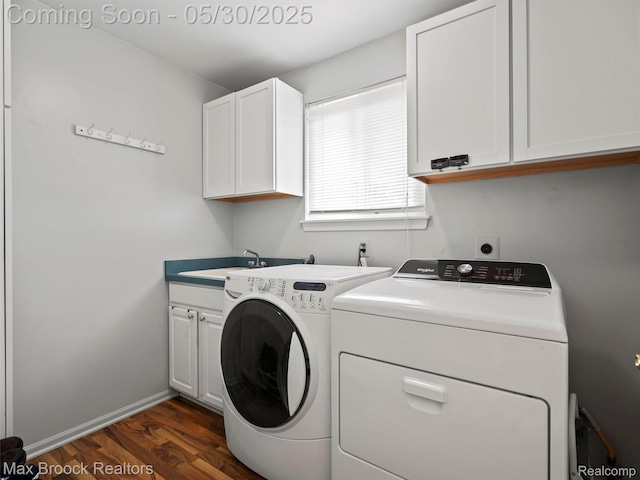6102 Cherry Ridge Dr, Howell, MI 48855 - laundry area with washer and clothes dryer, cabinet space, dark wood-type flooring, and baseboards