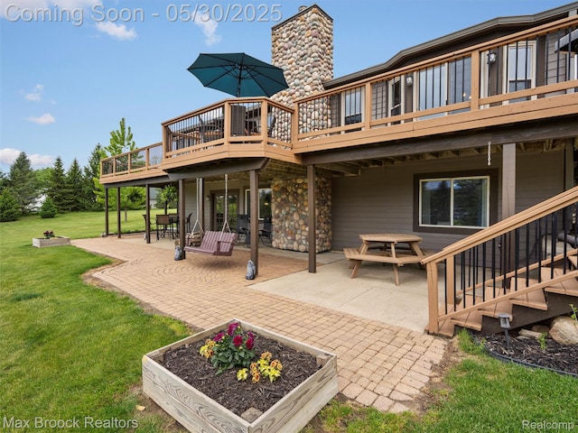 6102 Cherry Ridge Dr, Howell, MI 48855 - back of house with a patio area, a lawn, a wooden deck, and a garden