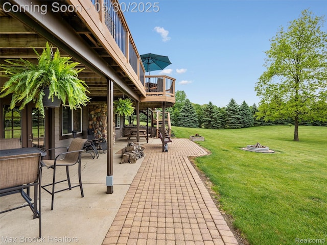 6102 Cherry Ridge Dr, Howell, MI 48855 - view of patio with an outdoor fire pit and a balcony