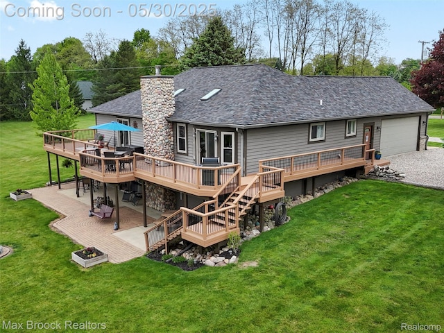 6102 Cherry Ridge Dr, Howell, MI 48855 - rear view of house with a deck, a shingled roof, a patio, a yard, and stairway