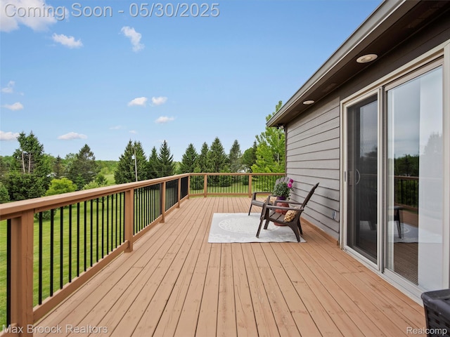 6102 Cherry Ridge Dr, Howell, MI 48855 - deck featuring a yard and view of scattered trees