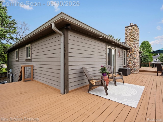 6102 Cherry Ridge Dr, Howell, MI 48855 - wooden deck featuring a grill