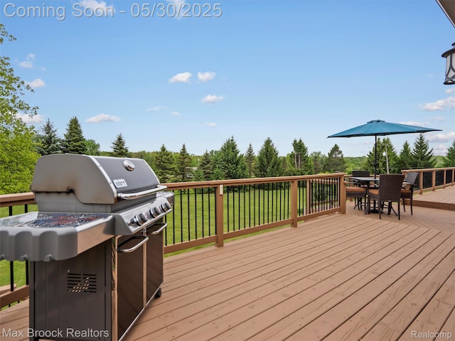 6102 Cherry Ridge Dr, Howell, MI 48855 - wooden terrace featuring outdoor dining area, a grill, and a lawn