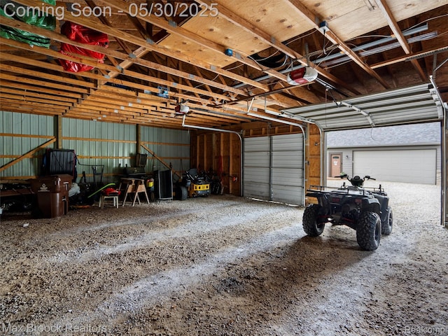 6102 Cherry Ridge Dr, Howell, MI 48855 - garage featuring a garage door opener