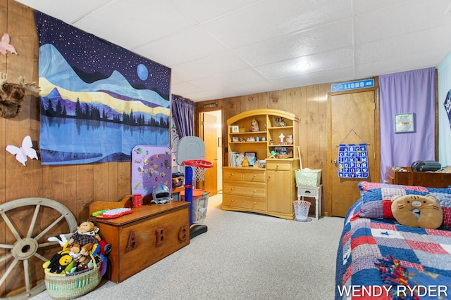937 Village Ct, Holland, MI 49423 - bedroom featuring wooden walls, carpet, and a drop ceiling