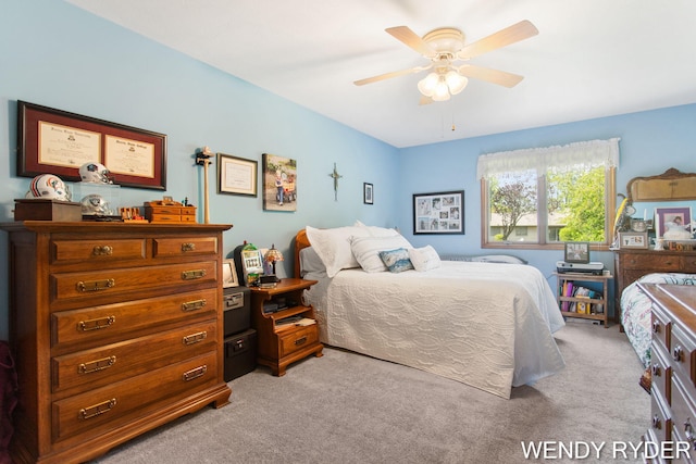 937 Village Ct, Holland, MI 49423 - bedroom with light colored carpet and ceiling fan