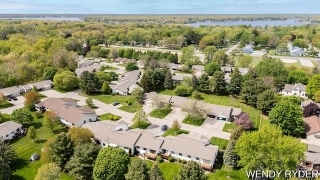 937 Village Ct, Holland, MI 49423 - aerial perspective of suburban area with a nearby body of water and a forest