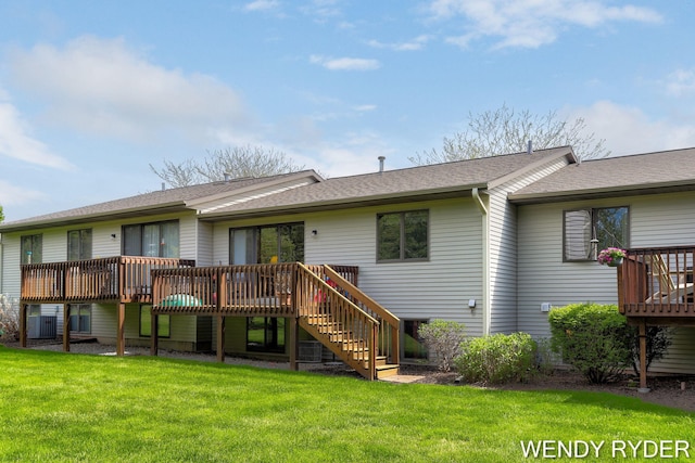 937 Village Ct, Holland, MI 49423 - rear view of house with a deck, stairs, a lawn, central air condition unit, and a shingled roof