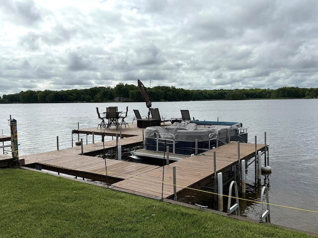 dock featuring a water view and a yard