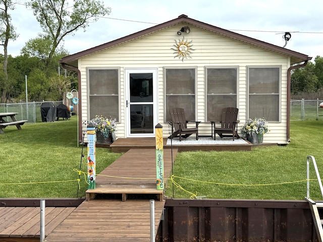 back of house featuring a deck