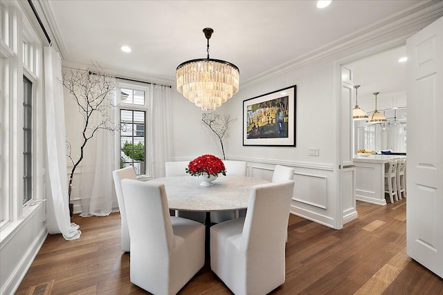 820 Hazel St, Birmingham, MI 48009 - dining space featuring a chandelier, dark wood-type flooring, crown molding, a wainscoted wall, and recessed lighting