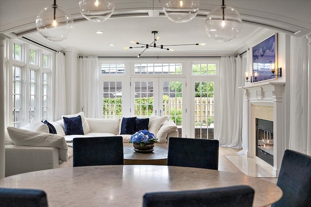 820 Hazel St, Birmingham, MI 48009 - dining space with ornamental molding, french doors, a chandelier, a premium fireplace, and recessed lighting
