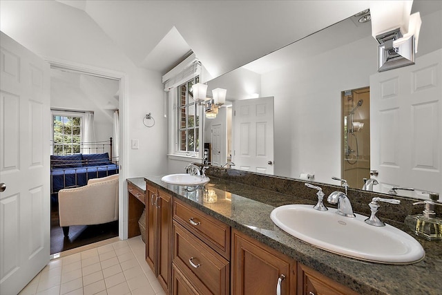 820 Hazel St, Birmingham, MI 48009 - ensuite bathroom featuring tile patterned flooring, vaulted ceiling, a shower stall, and double vanity