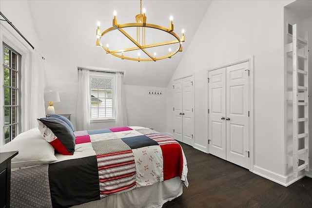 820 Hazel St, Birmingham, MI 48009 - bedroom featuring a chandelier, multiple closets, wood finished floors, multiple windows, and high vaulted ceiling