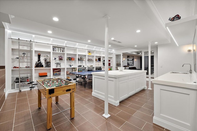 820 Hazel St, Birmingham, MI 48009 - playroom featuring a sink, recessed lighting, and built in shelves