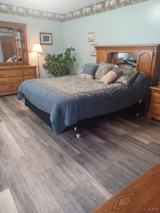 1186 Buckingham Ct, Adrian, MI 49221 - bedroom with wood finished floors