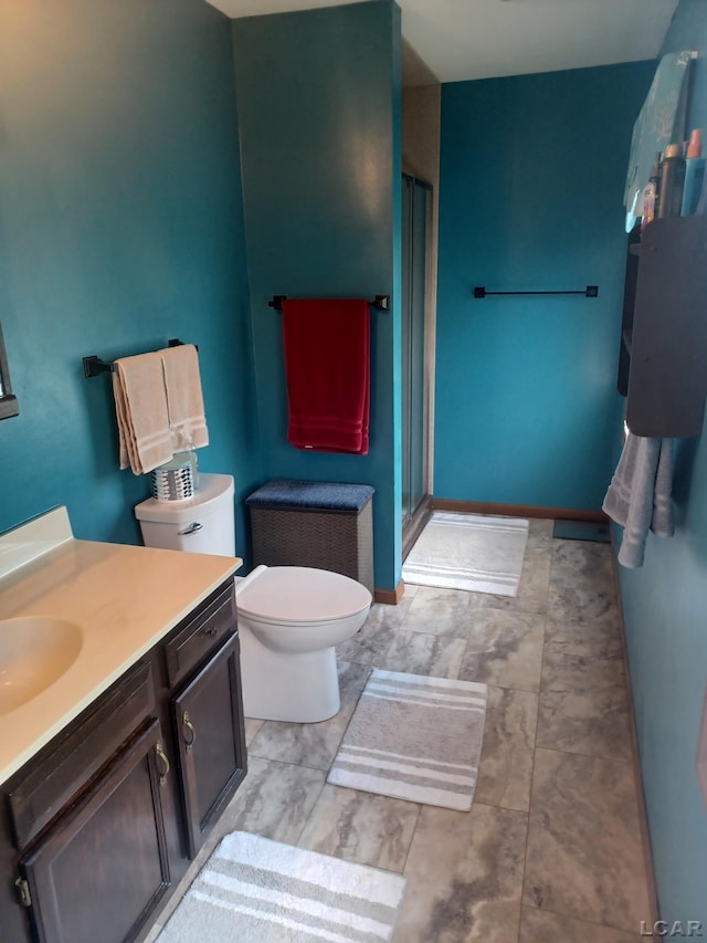 1186 Buckingham Ct, Adrian, MI 49221 - bathroom with a shower stall, vanity, and toilet