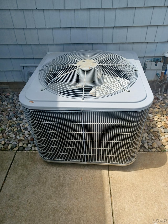 1186 Buckingham Ct, Adrian, MI 49221 - exterior view of central air condition unit