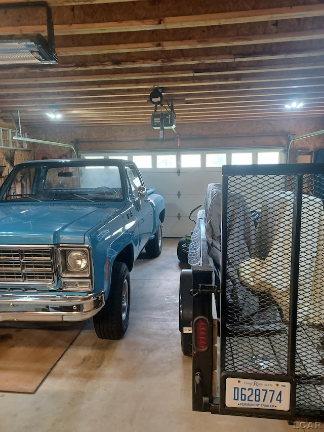 1186 Buckingham Ct, Adrian, MI 49221 - garage featuring a garage door opener