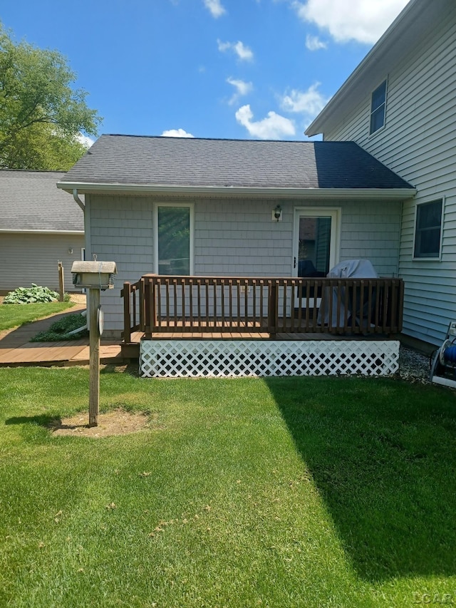 1186 Buckingham Ct, Adrian, MI 49221 - back of house with a lawn and roof with shingles