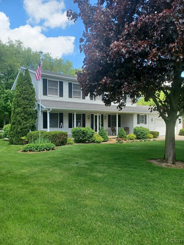1186 Buckingham Ct, Adrian, MI 49221 - view of front facade with a garage, a front lawn, a porch, and roof with shingles