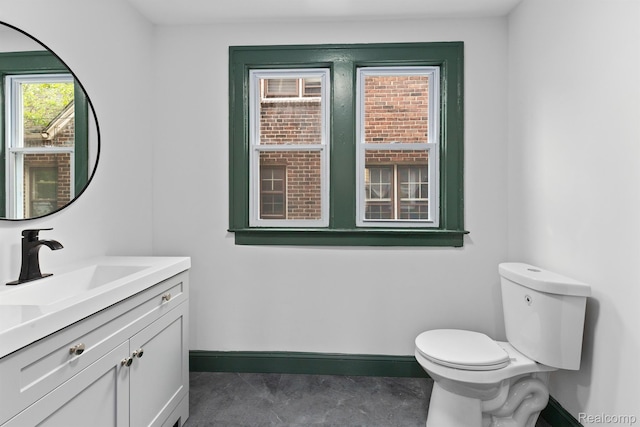 15781 Washburn St, Detroit, MI 48238 - half bathroom featuring baseboards, vanity, and toilet