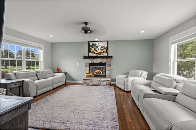 1600 Tuttle Rd, Mason, MI 48854 - living area featuring plenty of natural light, a ceiling fan, a fireplace, recessed lighting, and dark wood finished floors