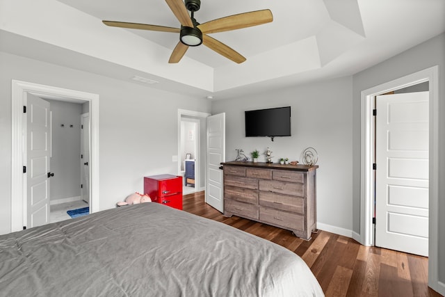 1600 Tuttle Rd, Mason, MI 48854 - bedroom with a raised ceiling, wood finished floors, baseboards, and ceiling fan