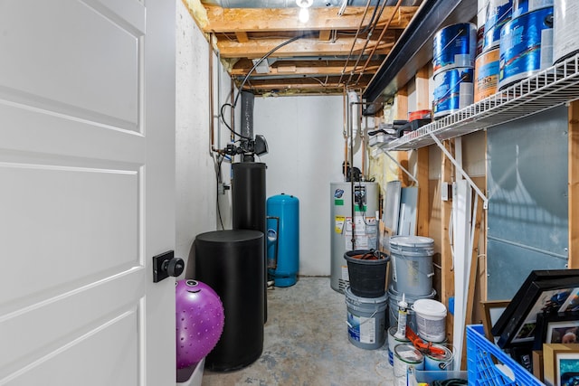 1600 Tuttle Rd, Mason, MI 48854 - unfinished below grade area with gas water heater and a water pressure tank