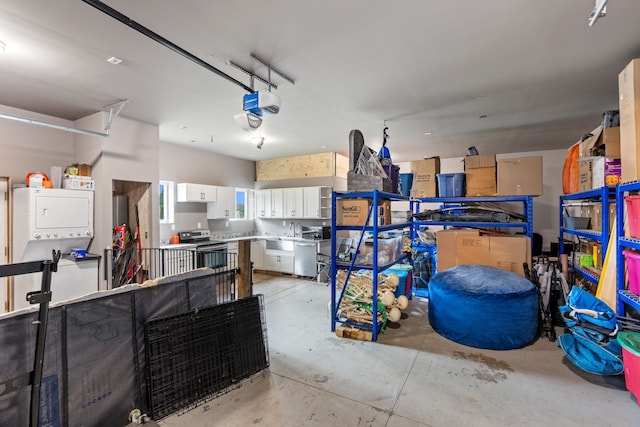 1600 Tuttle Rd, Mason, MI 48854 - garage with estacked washer and dryer, a garage door opener, and a sink