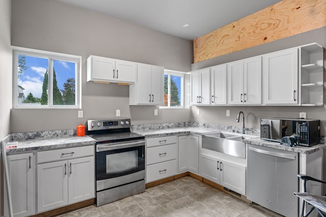 1600 Tuttle Rd, Mason, MI 48854 - kitchen featuring stainless steel appliances, a sink, open shelves, and white cabinets