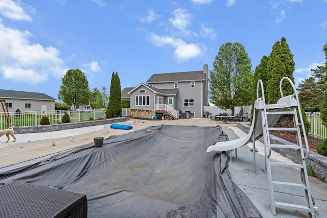1600 Tuttle Rd, Mason, MI 48854 - view of pool featuring a water slide and a patio