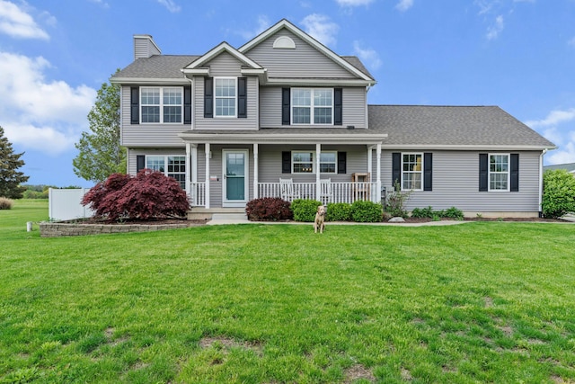 1600 Tuttle Rd, Mason, MI 48854 - view of front of home featuring covered porch, a chimney, and a front yard