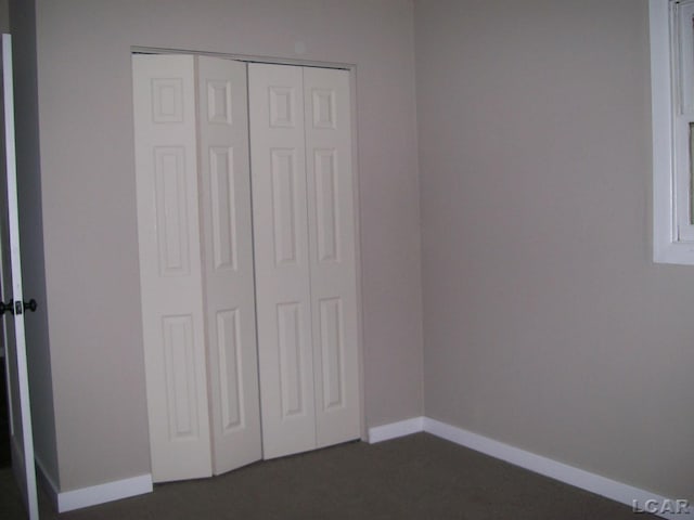 5300 State Rd, Hillsdale, MI 49242 - unfurnished bedroom featuring baseboards and a closet