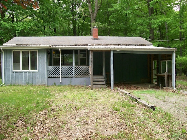 5300 State Rd, Hillsdale, MI 49242 - view of front of property featuring a chimney and a view of trees